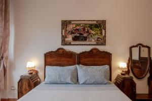 Postel nebo postele na pokoji v ubytování B&B I FILOKSENIA