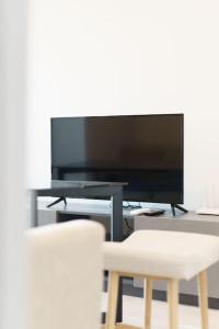 TV a/nebo společenská místnost v ubytování 4-Ideo New Rama 9 游泳池公寓 二房二卫WiFi