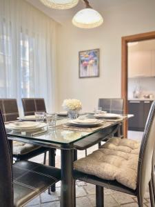 a dining room with a glass table and chairs at Great 2BDR Apartment in the Centre for 6 Guests in Stara Zagora