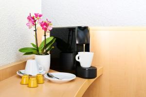 Kaffi- og teaðstaða á Ibis Como