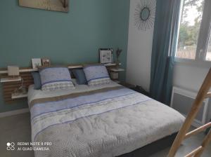 Posteľ alebo postele v izbe v ubytovaní Appartement La Savinière