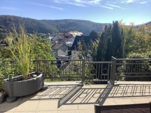 a balcony with a view of the mountains at Ferienwohnung Zur Sperrmauer in Edersee