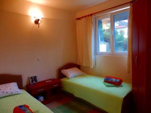 Postel nebo postele na pokoji v ubytování Apartments Vladilena