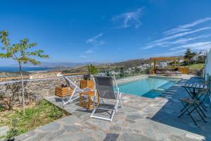 a villa with a swimming pool with a view at Magic Villa With Swimming Pool in Paros in Lefkes