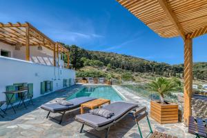 a villa with a swimming pool and a patio at Magic Villa With Swimming Pool in Paros in Lefkes