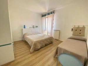 Postel nebo postele na pokoji v ubytování Vittoria Apartament