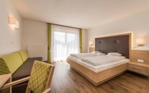 Postel nebo postele na pokoji v ubytování Hotel Meinhardt