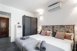 Postel nebo postele na pokoji v ubytování Sur Suites Palmeras 8 + 25 fotografií