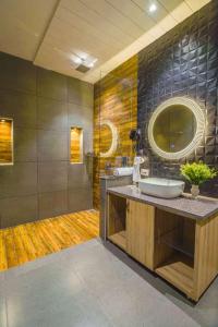 a bathroom with a sink and a mirror at Greenwood Villa By Levelup in Amritsar