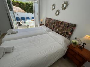 Posteľ alebo postele v izbe v ubytovaní Nerja Paradise Rentals - Villa Jade