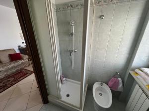 a bathroom with a shower and a toilet in it at Il Girasole - Apartment in Avezzano