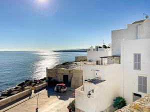 a view of the ocean from a building at Apulia Charming Suites - Casa Lonfo Suite Sole in Monopoli