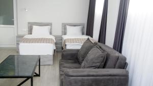 Voodi või voodid majutusasutuse Aventus Hotel toas