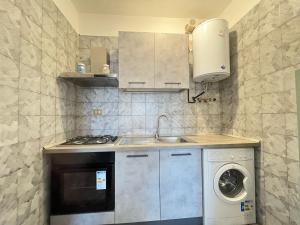 Kuchyň nebo kuchyňský kout v ubytování Imperiale Apartment