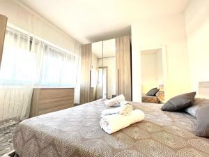 Postel nebo postele na pokoji v ubytování Imperiale Apartment