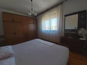 Postel nebo postele na pokoji v ubytování Apartment Laura