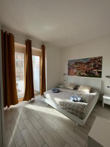 a bedroom with a bed and a large window at Red Moon in Cagliari