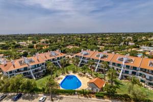 an aerial view of an apartment complex with a swimming pool at Vila Sol with Pool, Garden & Rooftop Terrace in Quarteira