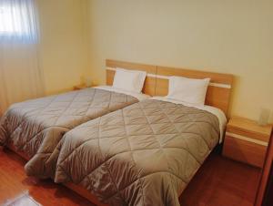 Un pat sau paturi într-o cameră la Pôr do Sol