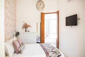 TV a/nebo společenská místnost v ubytování Hostal Benalup Atalaya