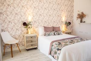 Postel nebo postele na pokoji v ubytování Hostal Benalup Atalaya