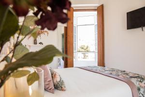 Postel nebo postele na pokoji v ubytování Hostal Benalup Atalaya