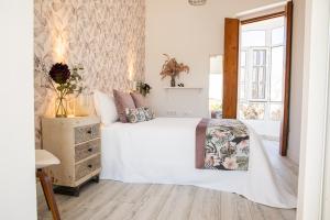 Postel nebo postele na pokoji v ubytování Hostal Benalup Atalaya