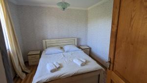 Postel nebo postele na pokoji v ubytování GreenHill - Your Guesthouse in Ubisa + 28 fotografií