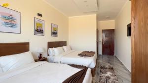 Ένα ή περισσότερα κρεβάτια σε δωμάτιο στο Happy View Inn