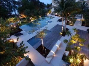 an overhead view of a swimming pool at night at 5 Stars Seafront Suite By The Sea 日落无敌全海景 5星 酒店等级 in Batu Ferringhi