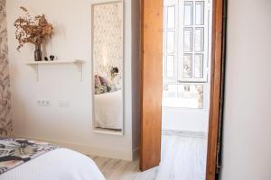 Postel nebo postele na pokoji v ubytování Hostal Benalup Atalaya