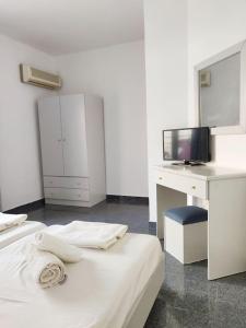 Postel nebo postele na pokoji v ubytování Atrium Apartment #3