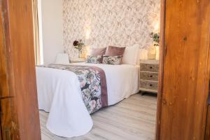 Postel nebo postele na pokoji v ubytování Hostal Benalup Atalaya