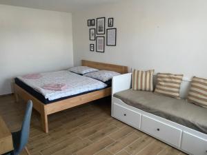 A bed or beds in a room at R-Penzion