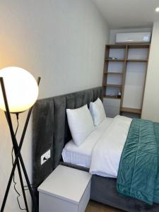Postel nebo postele na pokoji v ubytování Aparthotel Holiday Lux Batumi