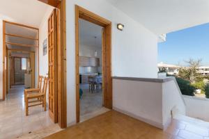 a view from the hallway of a house with a dining room at Complesso Pergolesi by BarbarHouse in Torre dell'Orso