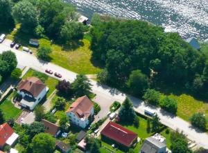 an aerial view of a house with a yard and a street at strandnahe FeWo mit Floß ( 24 h) und eigenem Kanu in Mirow