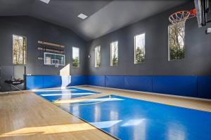 a gymnasium with a basketball court and blue walls at Punkin Manor in Newberg