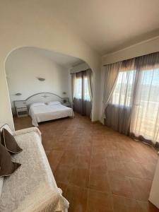 Postel nebo postele na pokoji v ubytování Hotel Micalosu