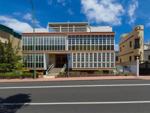 a building on the side of a street at City Family Ciudad Jardín in Las Palmas de Gran Canaria