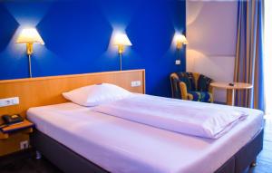 Posteľ alebo postele v izbe v ubytovaní Hotel Strohofer