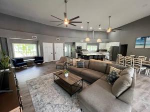 a living room with a couch and a dining room at Spacious 4 bedroom with 2 baths with Pool and boat dock in Crystal River
