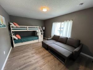 a living room with a couch and a bunk bed at Spacious 4 bedroom with 2 baths with Pool and boat dock in Crystal River +21 photos