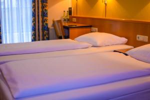 Posteľ alebo postele v izbe v ubytovaní Hotel Strohofer