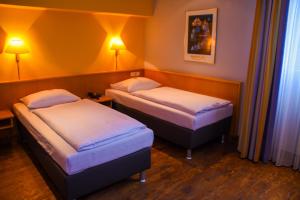 Posteľ alebo postele v izbe v ubytovaní Hotel Strohofer