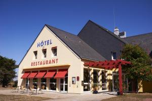 a hotel building with a sign that reads hotel restaurant at Logis De La Loire in Ancenis