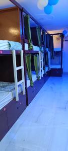 a bus with two bunk beds in a room at Frazyone hostel in New Delhi