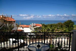 a view of the ocean from the balcony of a house at Ανεμώνη Apartments in Gialiskari
