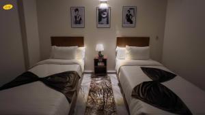 Ένα ή περισσότερα κρεβάτια σε δωμάτιο στο Happy View Inn