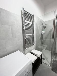 a bathroom with a shower and a toilet and a sink at Guest House Arya in Rome
